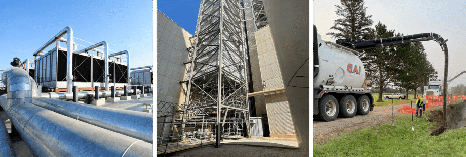 A tall metal scaffolding structure between buildings under a clear blue sky.