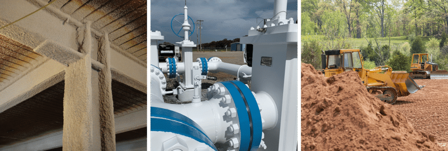 Industrial piping with valves and blue flanges on a cloudy day.